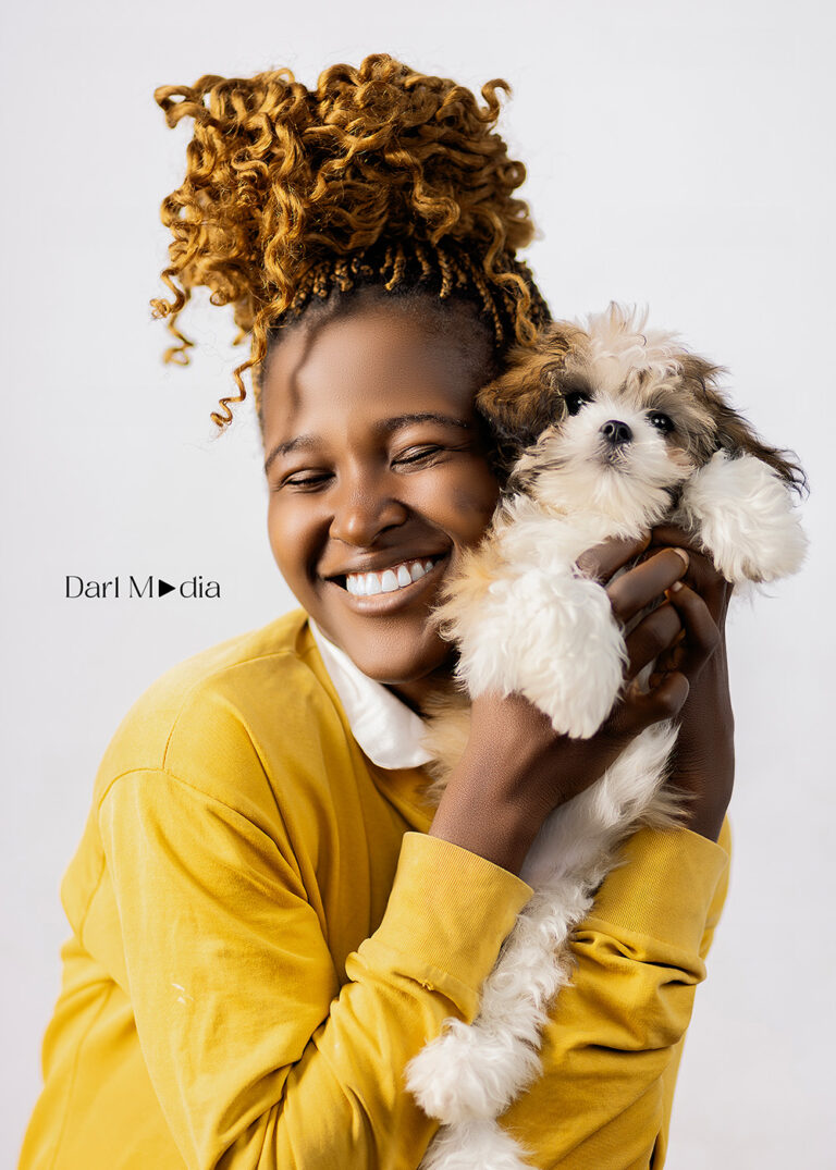 A happy client with her pet at Darl Media